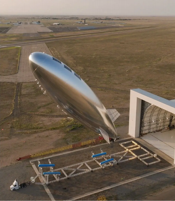 Picture looking down at a blimp in the air
